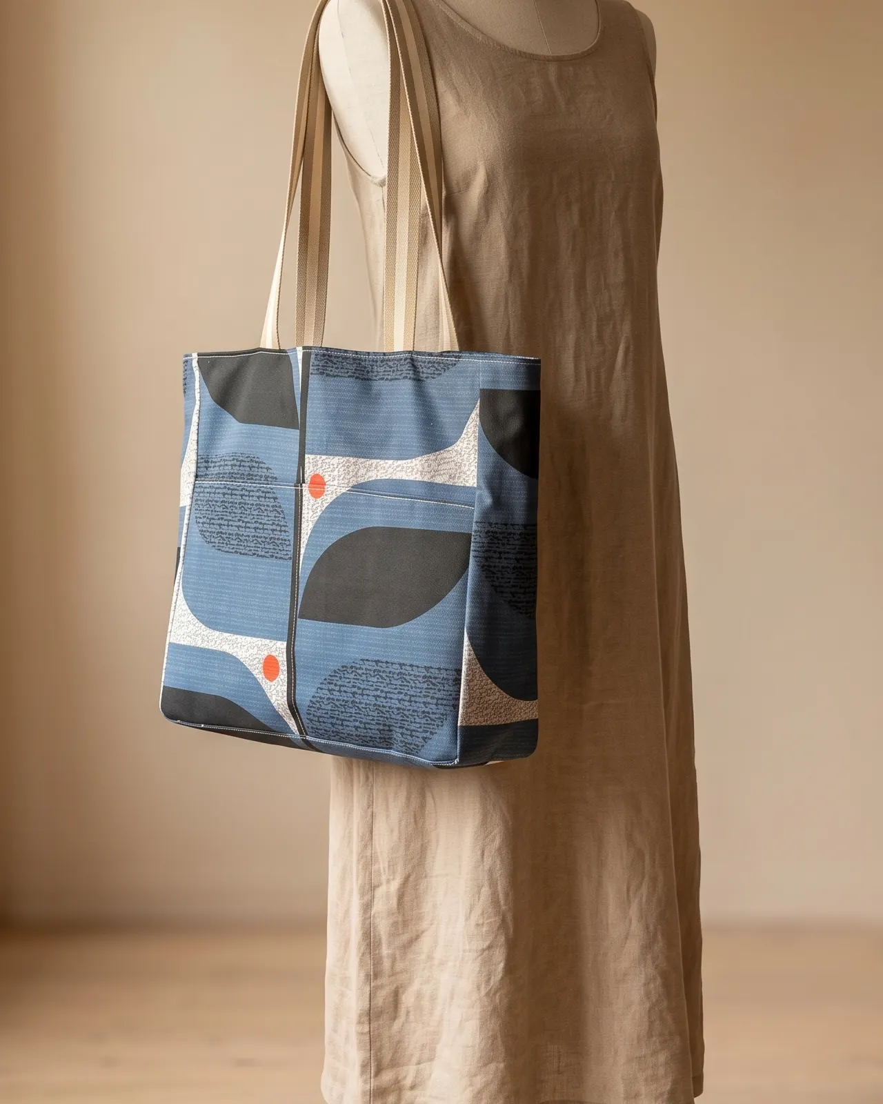 Large Tote Bag - Blue Mid Mod Geometric worn on the shoulder on a display form
