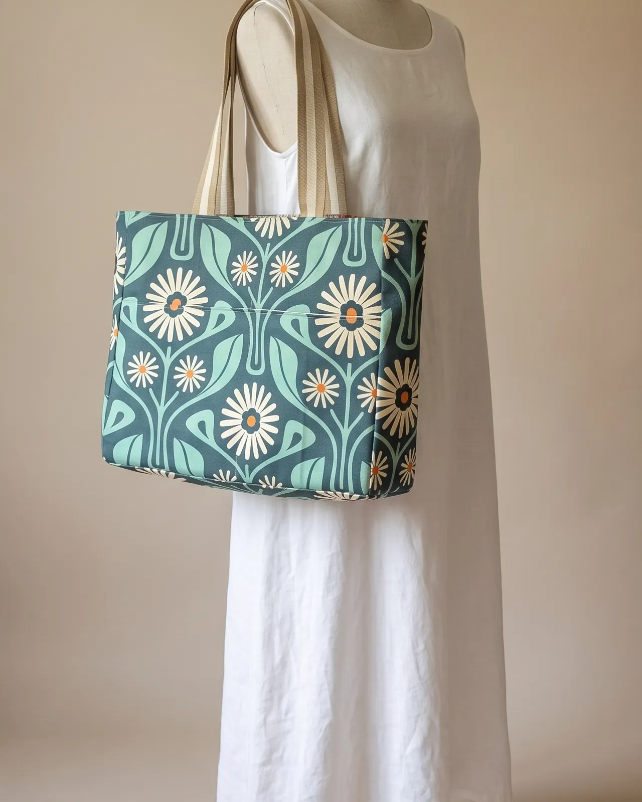 Large Tote Bag - Teal Retro Daisy worn on the shoulder on a display form
