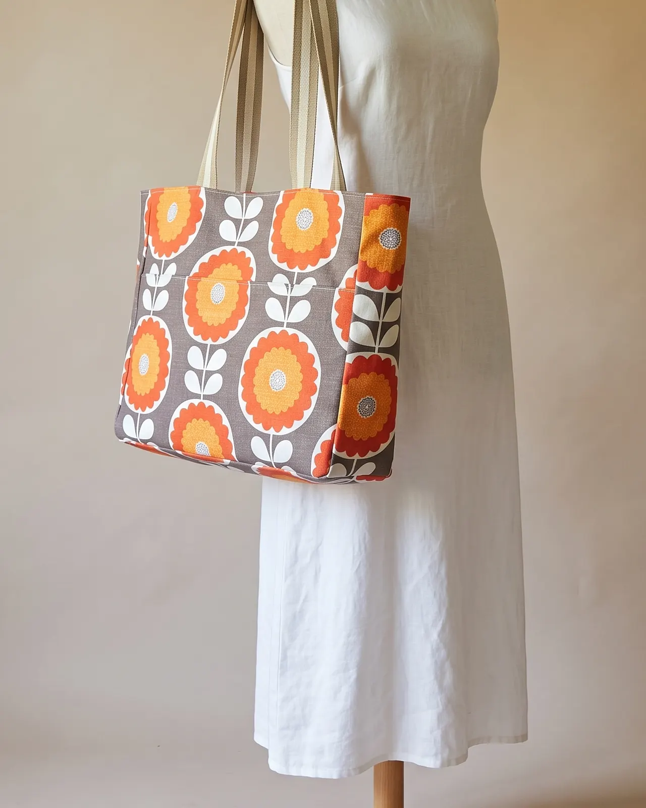 Large Tote Bag- Zipper worn on the shoulder on a display form
