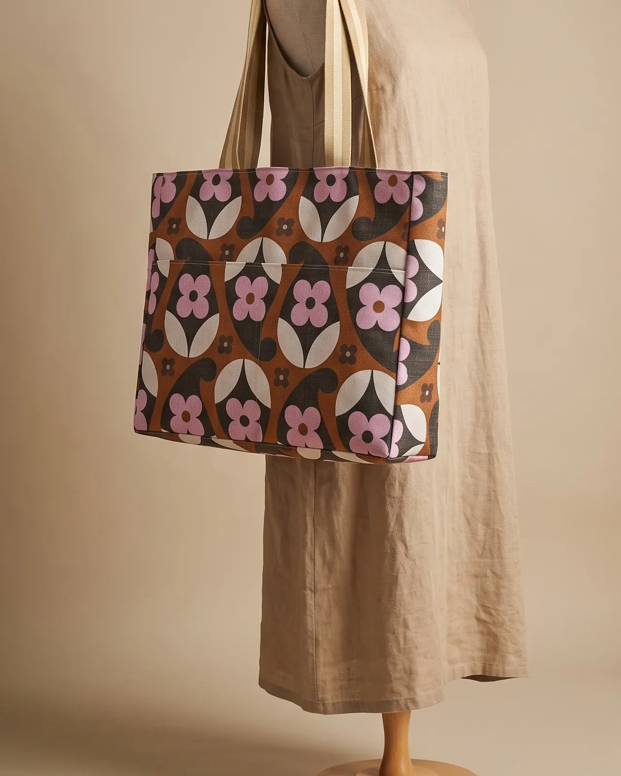 Large Tote Bag Zipper - Brown Retro Floral worn on the shoulder on a display form