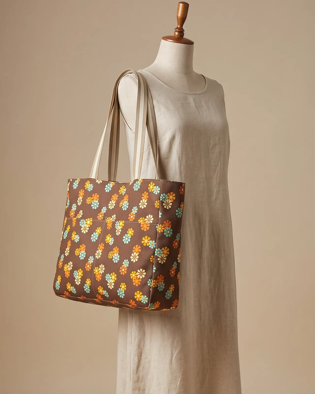 Large Tote Bag Zipper - Brown Retro Daisy worn on the shoulder on a display form