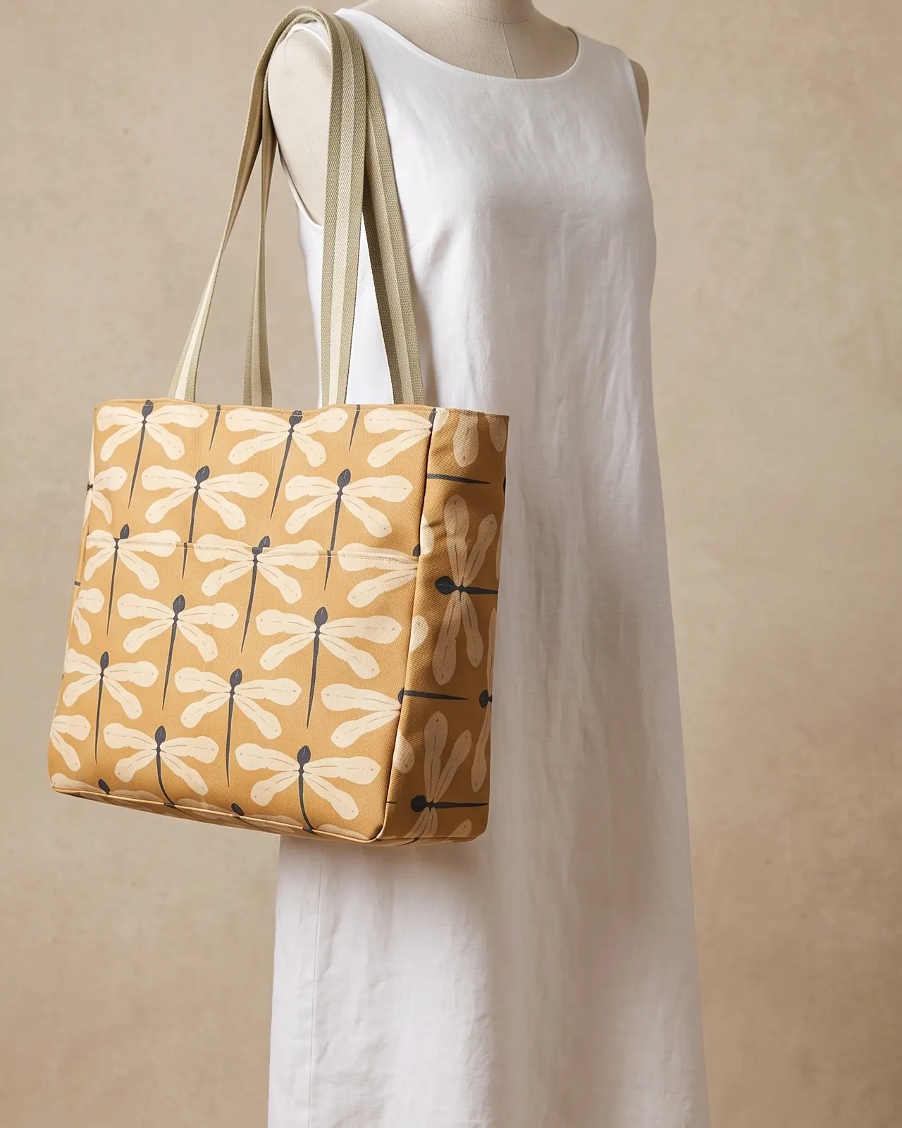 Large Tote Bag Zipper - Mustard Dragonfly worn on the shoulder on a display form