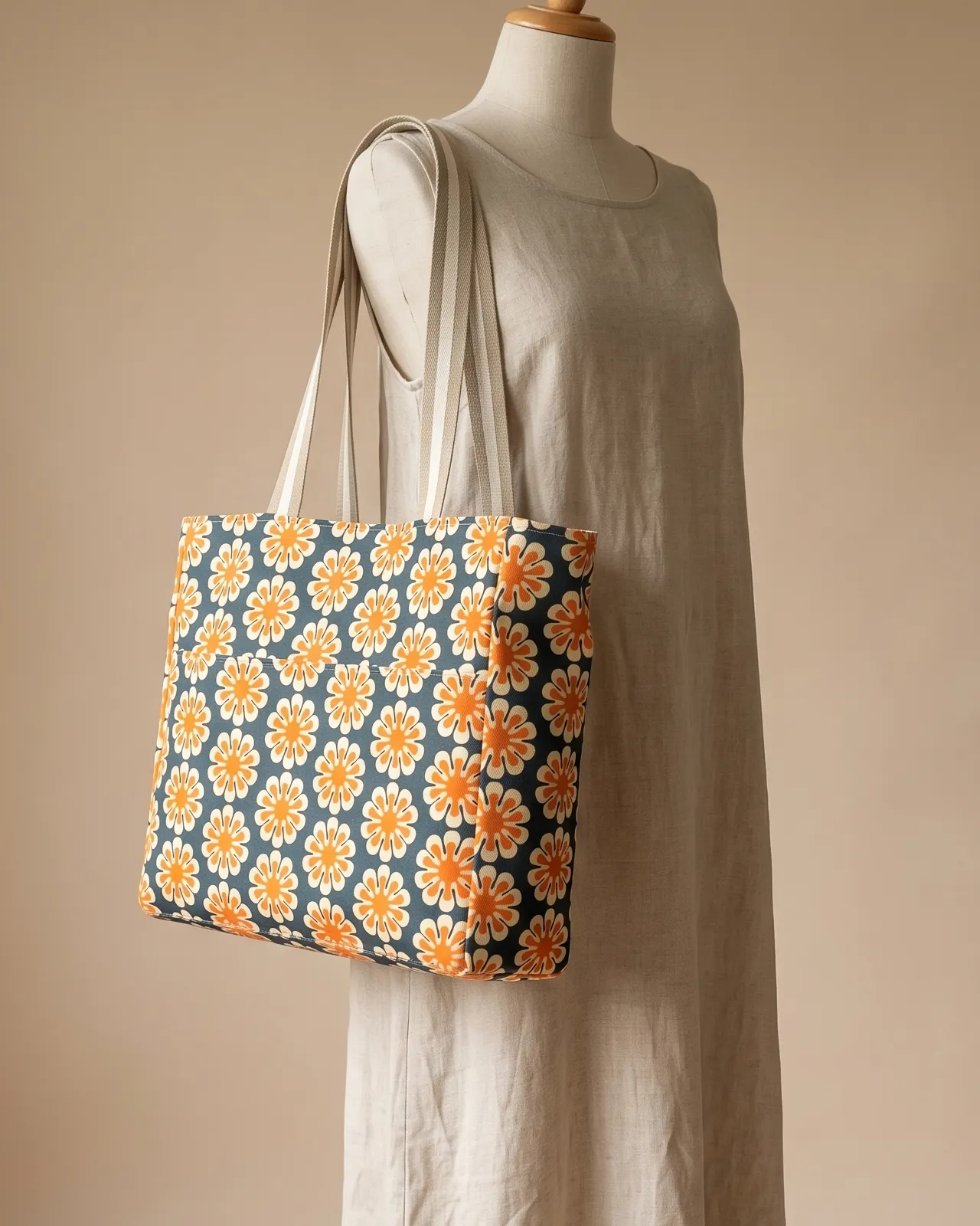 Large Tote Bag Zipper - Navy Retro Daisy worn on the shoulder on a display form