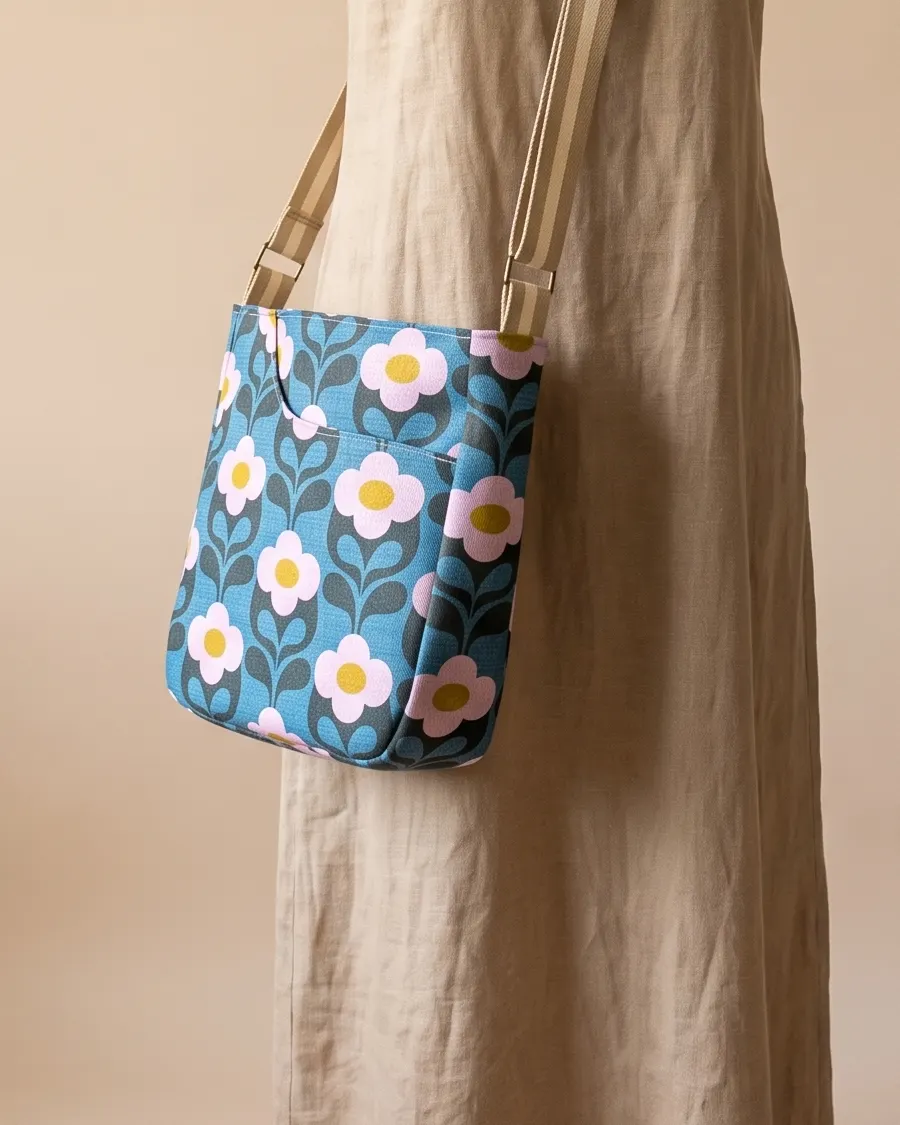CrossBody Handbag - Teal Retro Daisy worn crossbody on a display form