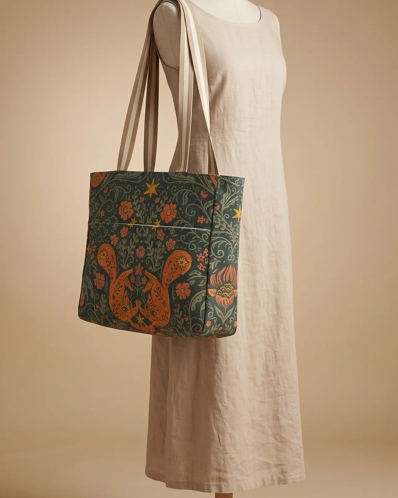 Large Tote Bag - Teal Cat Floral worn on the shoulder on a display form