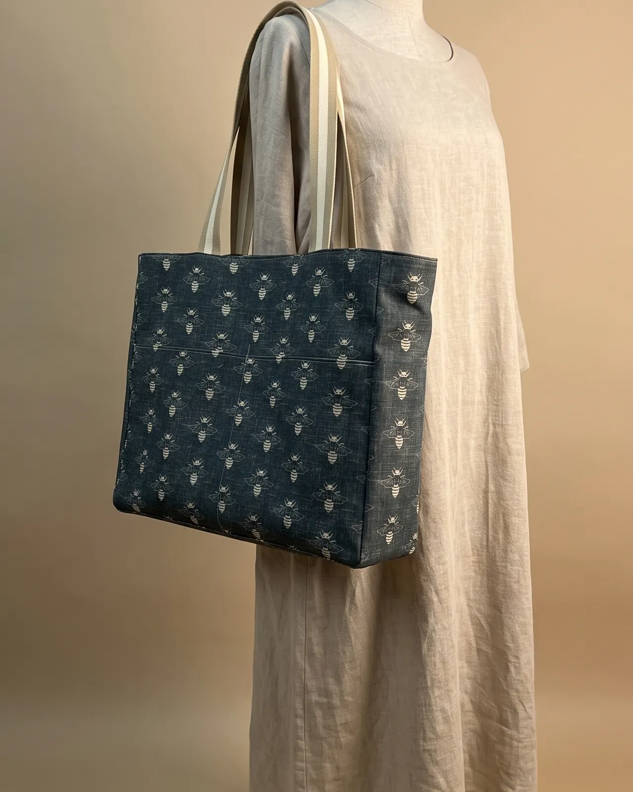 Large Tote Bag Zipper - Slate Bumble Bee worn on the shoulder on a display form
