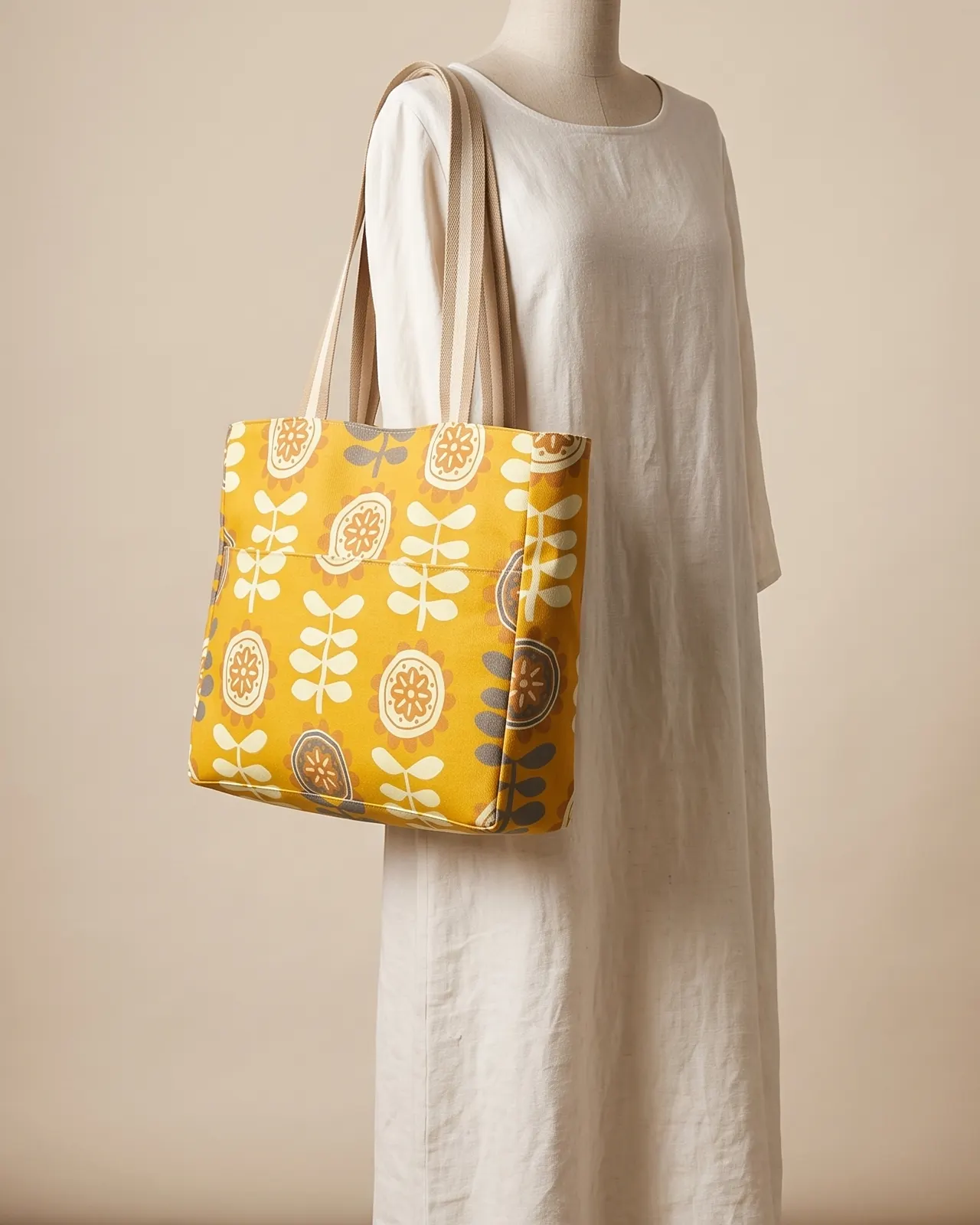 Large Tote Bag Zipper - Mustard Retro Floral worn on the shoulder on a display form