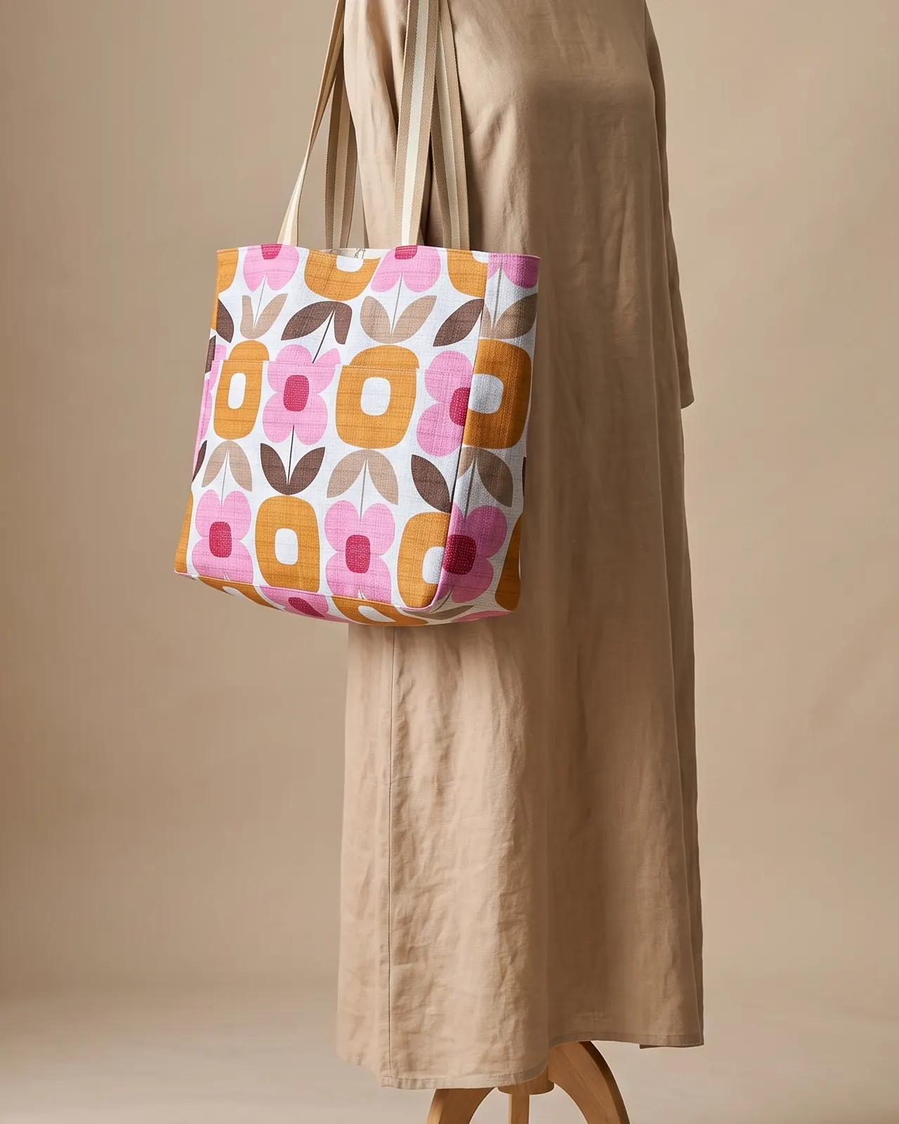 Large Tote Bag - Pink Retro Floral worn on the shoulder on a display form