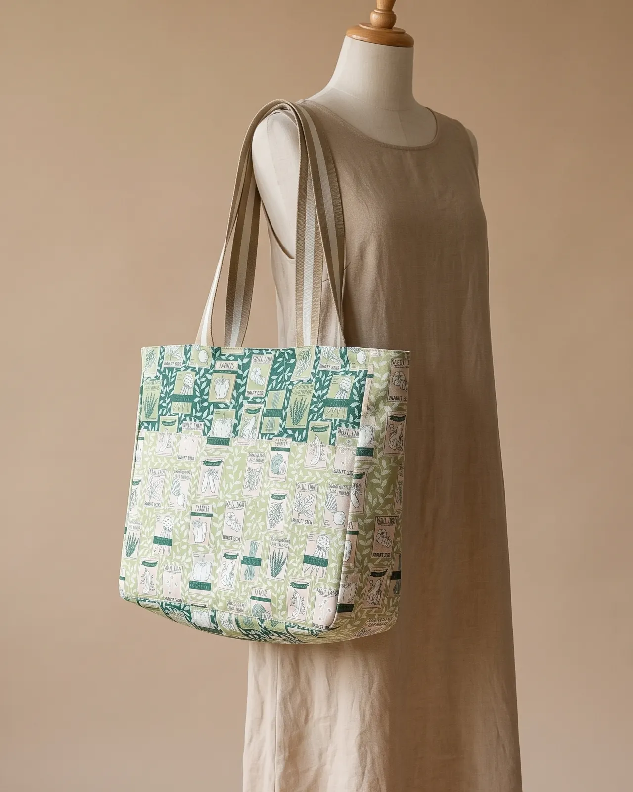 Large Tote Bag Zipper - Green Seed Packet worn on the shoulder on a display form
