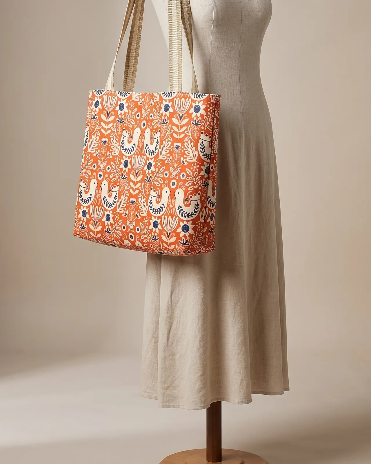 Large Tote Bag Zipper - Red Folk Bird worn on the shoulder on a display form