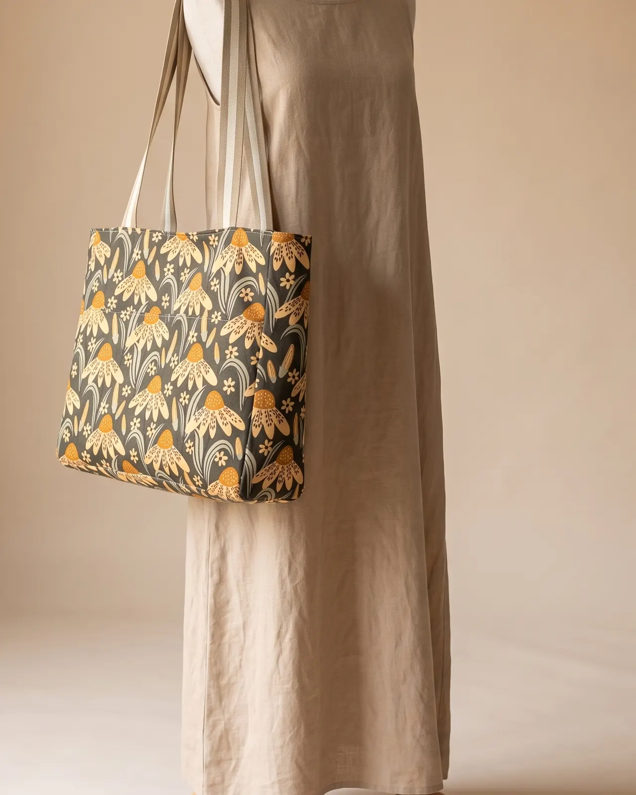 Large Tote Bag Zipper - Charcoal Yellow Coneflower worn on the shoulder on a display form