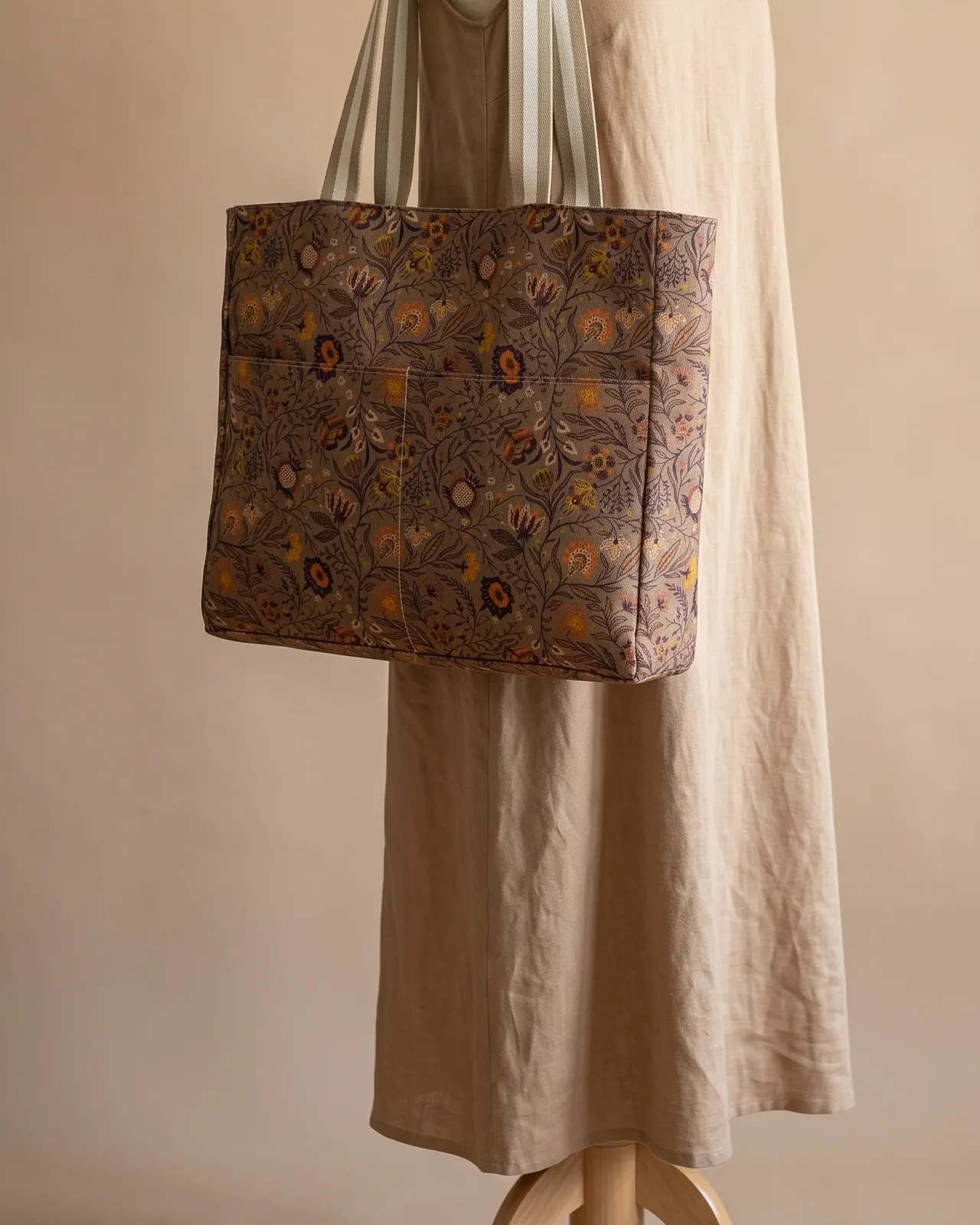Large Tote Bag Zipper - Autumn Brown Vintage Floral worn on the shoulder on a display form