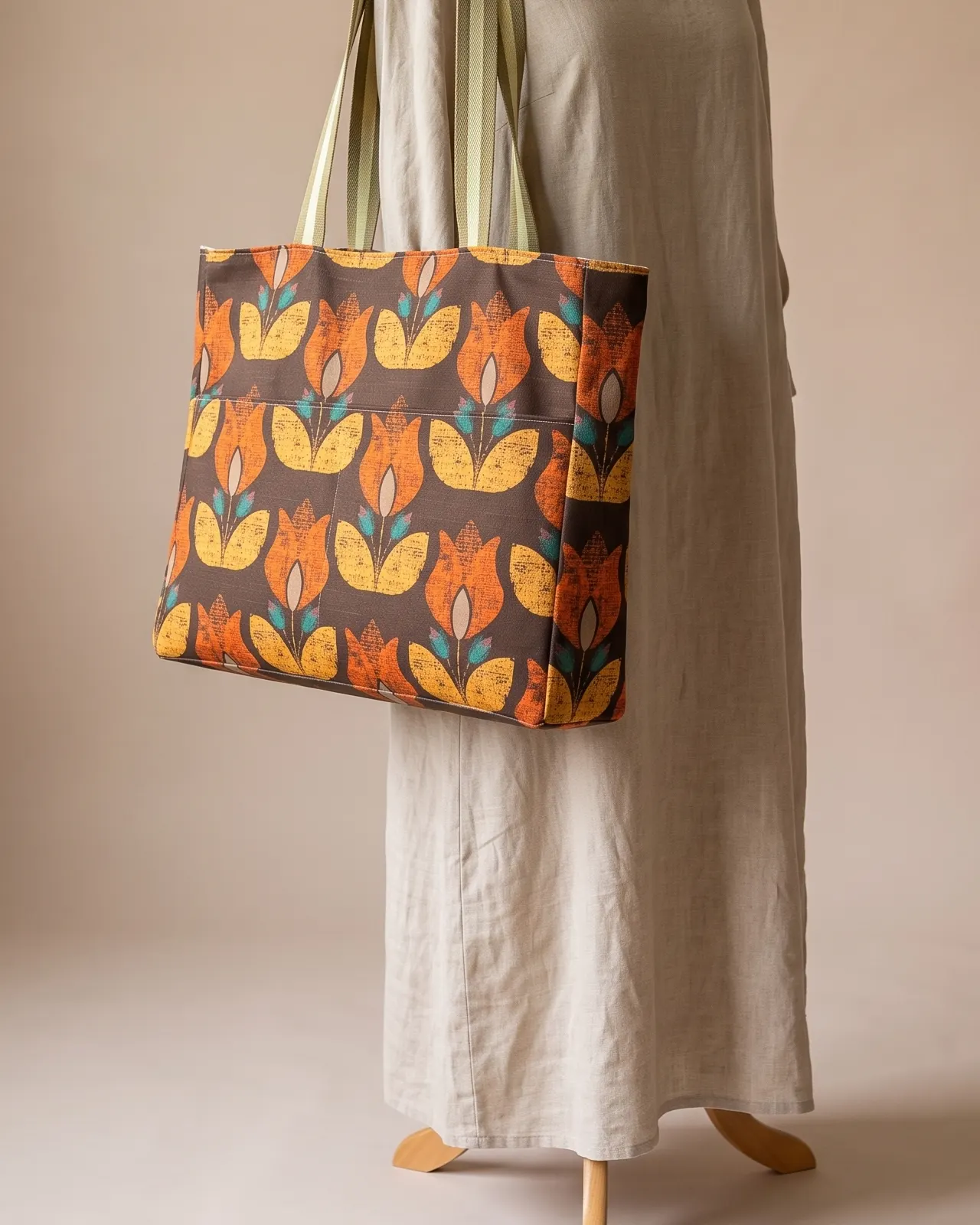 Large Tote Bag Zipper - Brown Retro Tulip worn on the shoulder on a display form