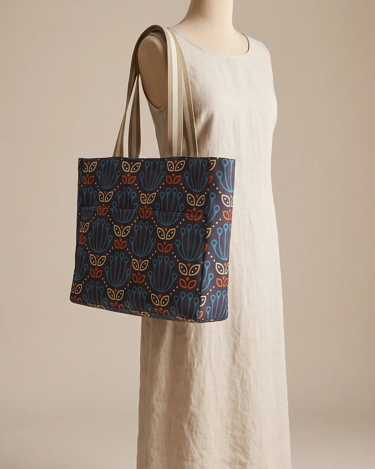 Large Tote Bag Zipper - Navy Mid Mod Tulip worn on the shoulder on a display form