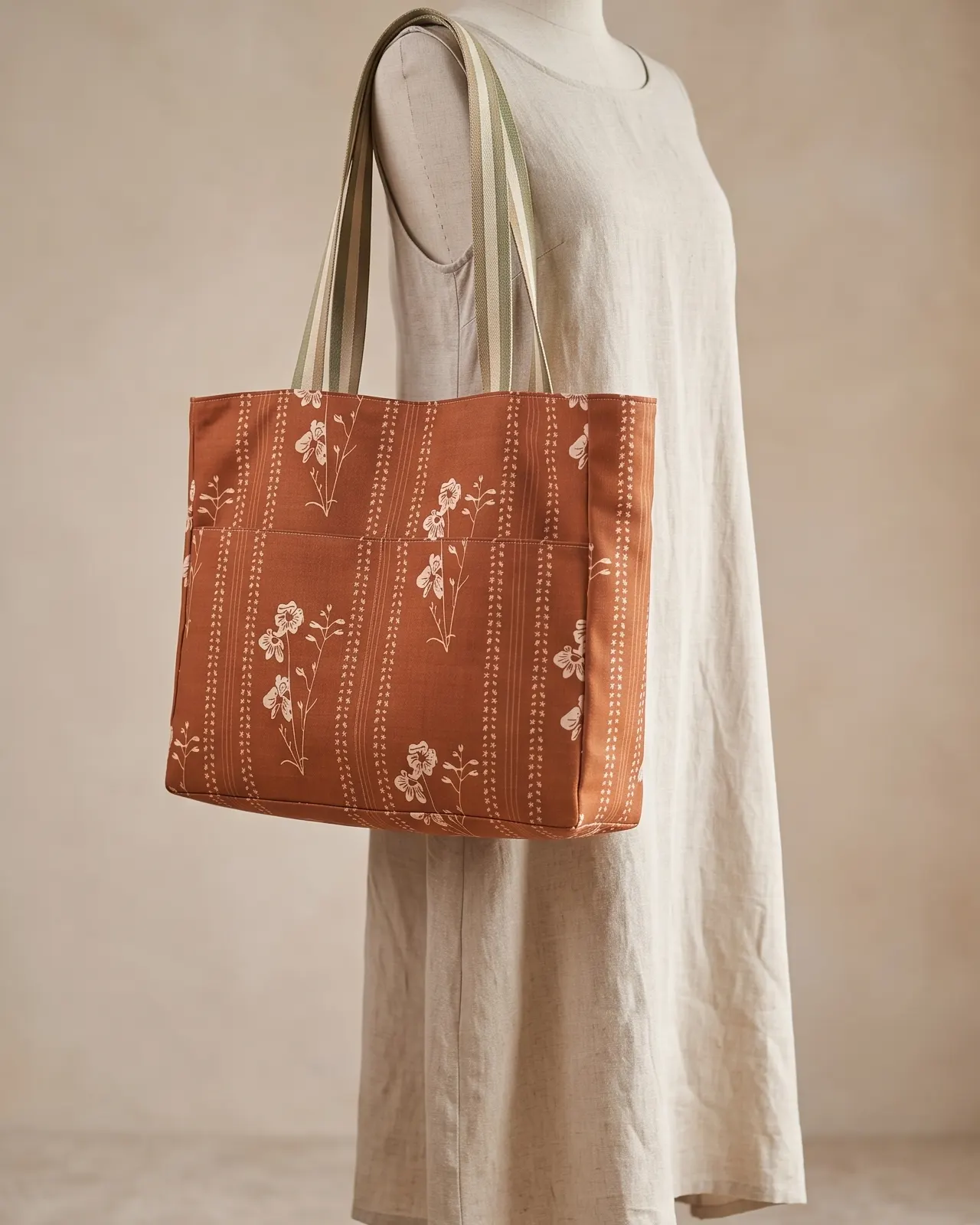 Large Tote Bag Zipper - Brown Vintage Floral worn on the shoulder on a display form