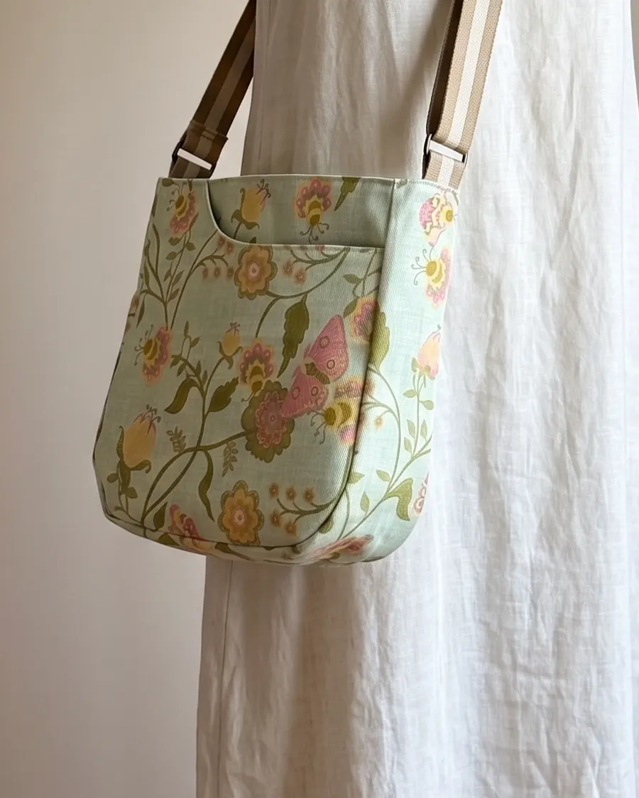 CrossBody Handbag - Mint Butterfly Floral worn crossbody on a display form