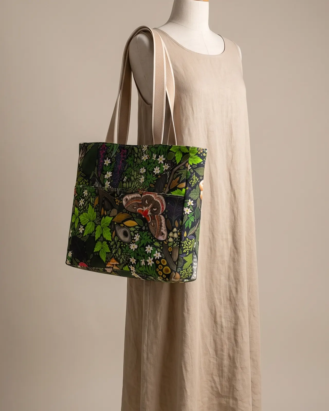 Large Tote Bag Zipper - Moth Jungle worn on the shoulder on a display form